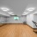 large room with wood floors and mirror