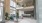 large room with plants and seating area
