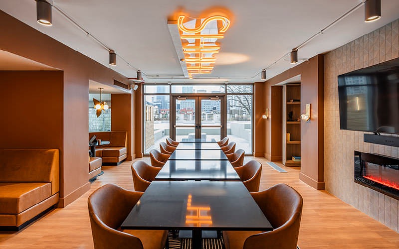 speakeasy room with tables and chairs